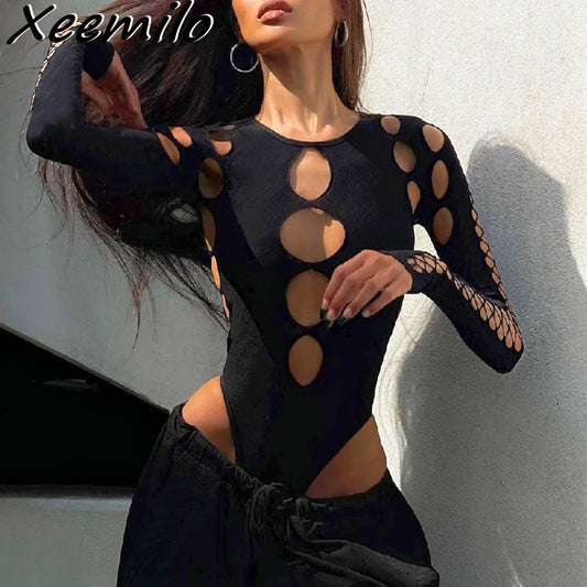 Black bodysuit with cut-out design worn by a model against a neutral background, front side