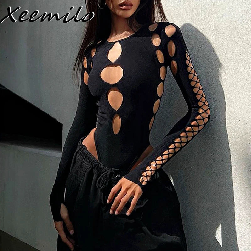Black bodysuit with cut-out design worn by a model against a neutral background, quarter turn front side